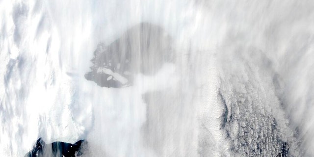 This satellite image provided by NASA, Terra MODIS 8 on March 2022 shows the original extent of C-37 through cloud next to Bowman Island. Scientists are concerned because an ice shelf the size of New York City collapsed in East Antarctica, an area that had long been thought to be stable. The collapse last week was the first time scientists have ever seen an ice shelf collapse in this cold area of Antarctica.