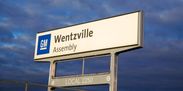 This March 24, 2021, file photo shows a sign near an entrance to a General Motors assembly plant in Wentzville, Missouri. A whopping 50 million vehicles on the road have open recalls. Thousands of Fords, Nissans, Hyundais and Hondas were recently added to the National Highway Traffic Safety Administration's list.