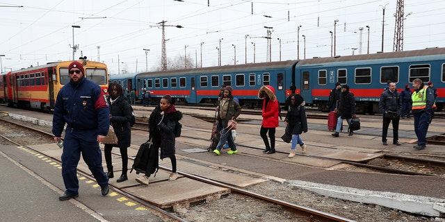 This photo taken at the Ukraine-Poland border shows people carrying whatever they could grab from their homes. 