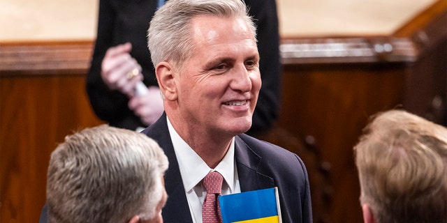 House Minority Leader Kevin McCarthy of Calif., wears a Ukrainian flag in his pocket in the chamber of the House of Representatives before the State of the Union address by President Biden to a joint session of Congress at the Capitol, Tuesday, March 1, 2022, in Washington.. (Jim Lo Scalzo/Pool via AP)