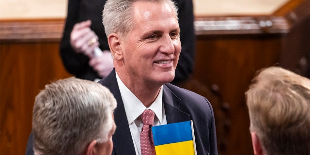 House Minority Leader Kevin McCarthy of Calif., wears a Ukrainian flag in his pocket in the chamber of the House of Representatives before the State of the Union address by President Biden to a joint session of Congress at the Capitol, Tuesday, March 1, 2022, in Washington.. (Jim Lo Scalzo/Pool via AP)