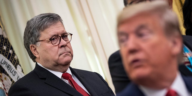 Attorney General William Barr and President Trump attend a signing ceremony for an executive order establishing the Task Force on Missing and Murdered Native Americans and Native Alaskans in the Oval Office of the White House on November 26, 2019. in Washington, DC.  Barr said he will only support Trump in the 2024 election if he is nominated by the GOP.