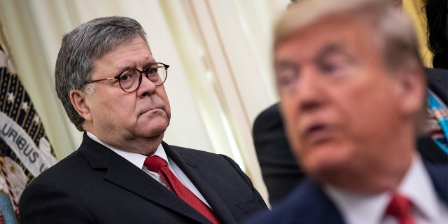 Attorney General William Barr and President Trump attend a signing ceremony for an executive order on Nov. 26, 2019, in Washington, DC. 