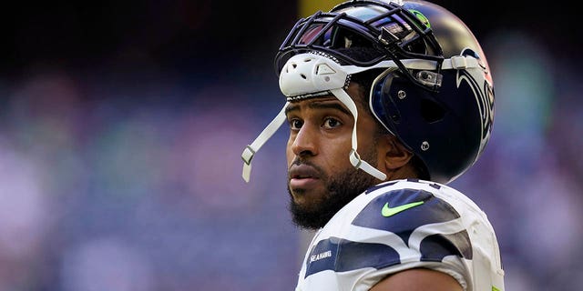 Seattle Seahawks linebacker Bobby Wagner pauses during the team's NFL football game against the Houston Texans on Dec. 12, 2021, in Houston.