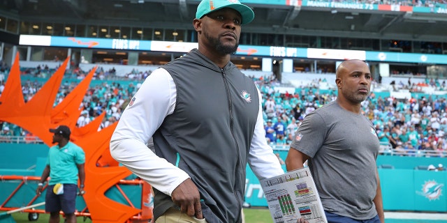 Dolphins coach Brian Flores takes the field for Miami's game against the New York Giants on Dec. 5, 2021.
