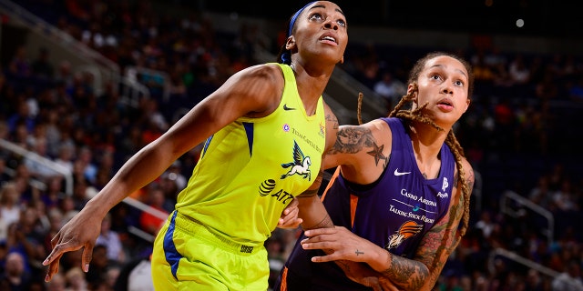 Glory Johnson #25 of the Dallas Wings and Brittney Griner #42 of the Phoenix Mercury fight for position on August 10, 2019 at the Talking Stick Resort Arena, in Phoenix, Arizona.