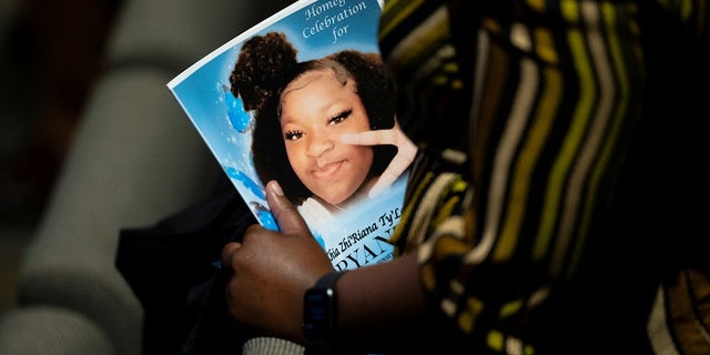 A person attends the funeral of Ma'Khia Bryant, a Black teenage girl fatally shot by police, in Columbus, Ohio, U.S., April 30, 2021. Columbus police officer Nicholas Reardon will face criminal charges, prosecutors said Friday.