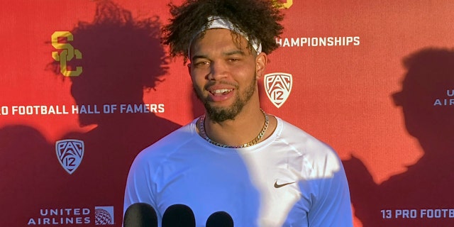 Southern California NCAA college football quarterback Caleb Williams speaks to reporters after his first spring practice on Tuesday, March 22, 2022, in Los Angeles. Williams transferred from Oklahoma to USC in February, following head coach Lincoln Riley.
