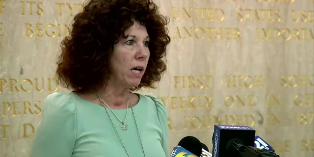 Lebanon Mayor Sherry Capello speaks to reporters following a shooting that killed a police officer and injured three others on Thursday. 