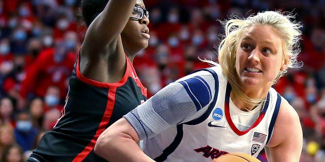 Arizona forward Cate Reese (25) moves around UNLV center Desi-Rae Young (23) while looking for a shot during a first-round game in the NCAA women's college basketball tournament Saturday, March 19, 2022, in Tucson, Ariz.