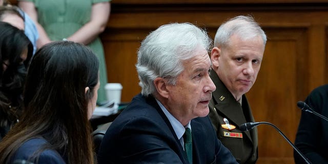 FILE - Central Intelligence Agency Director William Burns, center, testifies on Capitol Hill in Washington, March 8, 2022, during a House Permanent Select Committee on Intelligence hearing on worldwide threats. He is flanked by Director of National Intelligence Avril Haines, left, and Defense Intelligence Agency Director Lt. Gen. Scott Berrier, right. Burns has tested positive for COVID-19, according to an agency statement Thursday, March 31. (AP Photo/Susan Walsh, File)