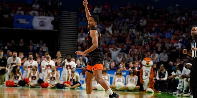 Miami guard Charlie Moore (3) celebrates after scoring during the second half of a college basketball game against Auburn in the second round of the NCAA tournament Sunday, March 20, 2022, in Greenville, S.C.