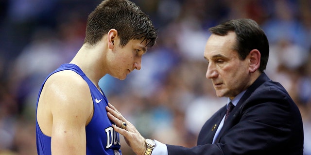 Duke guard Grayson Allen talks with head coach Mike Krzyzewski during the second half of an NCAA college basketball game in the Atlantic Coast Conference Tournament against Notre Dame in Washington, March 10, 2016. Allen is now with the NBA champion Milwaukee Bucks. 