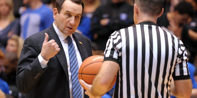 Head coach Mike Krzyzewski of the Duke Blue Devils talks to a referee during a game against the North Carolina Tar Heels at Cameron Indoor Stadium Feb. 18, 2015, in Durham, N.C. Duke defeated North Carolina 92-90 in OT.