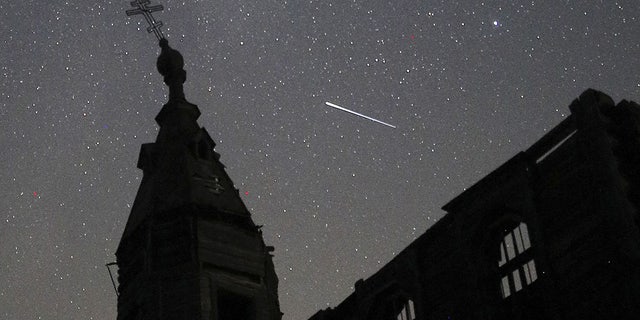  A view of the Perseid meteor shower over the Church of St Paraskevi of Iconium in the village of Russkoye Khodyashevo in Russia's Republic of Tatarstan. The Perseid meteor shower occurs every year from July 23 through August 24 when the Earth passes through the dust of the 109P/Swift-Tuttle comet; dust particles hit the Earth's upper atmosphere and burn, what is seen from the Earth as the meteor shower. 