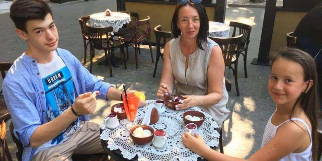 Kozlov's mom and sister are volunteering by making military nets and cooking food for people without shelter. Ivan Kozlov is shown here with his mom and sister.