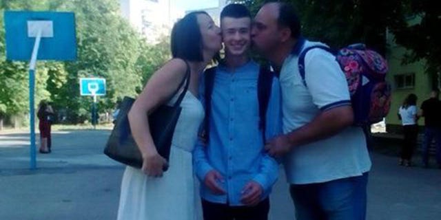 Even while he's thousands of miles away, Kozlov is doing his part for his home country of Ukraine, too. He raised almost $9,000 in a bake sale at his high school. Kozlov is pictured here with his parents.