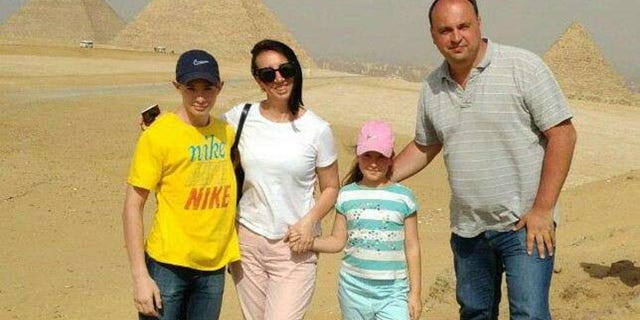 Though Kozlov is in Colorado, his parents and 10-year-old sister are still in Ukraine. Kozlov (above, left) is pictured here with his family.