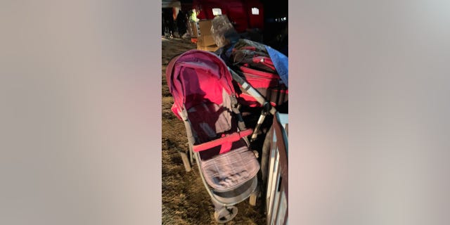 A stroller is shown parked at the Poland-Ukraine border.