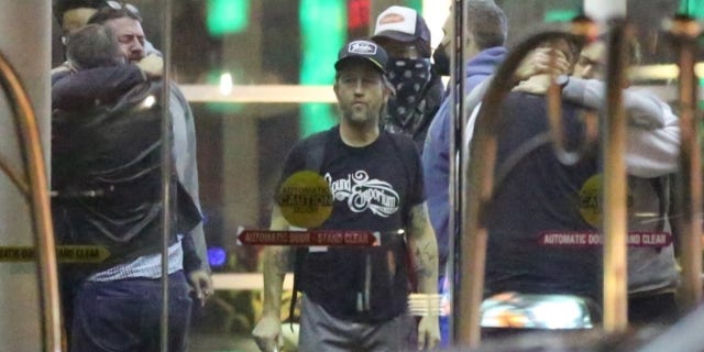 Dave Grohl arrives back in Los Angeles after Hawkins' death.