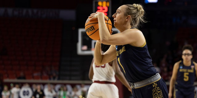 Notre Dame guard Dara Mabrey (1) prepares to shoot a 3-point basket in the first half of a second-round game against Oklahoma in the NCAA women's college basketball tournament Monday, March 21, 2022, in Norman, Okla.