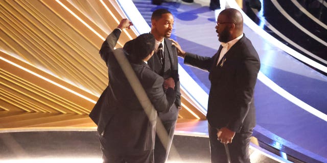 Denzel Washington, and Tyler Perry comfort Will Smith during the show at the 94th Academy Awards at the Dolby Theatre at Ovation Hollywood on Sunday, March 27, 2022.