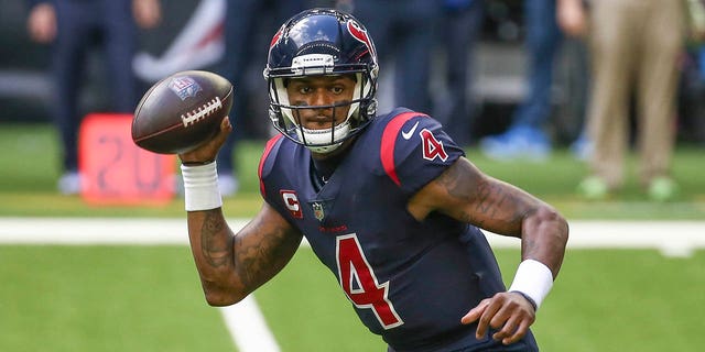 Texans quarterback Deshaun Watson rolls out of the pocket against the Cincinnati Bengals at NRG Stadium in Houston on Dec. 27, 2020.