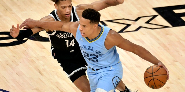 Memphis Grizzlies guard Desmond Bane (22) works against Brooklyn Nets forward Kessler Edwards (14) during the second half of an NBA basketball game Wednesday, March 23, 2022, in Memphis, Tenn.