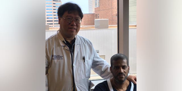 Donald Crigler (right, seated) and Dr. Andrew Kao are pictured here. Kao, the medical director of heart transplantation at Saint Luke’s Mid America Heart Institute, was the doctor for Donald and Ronald.