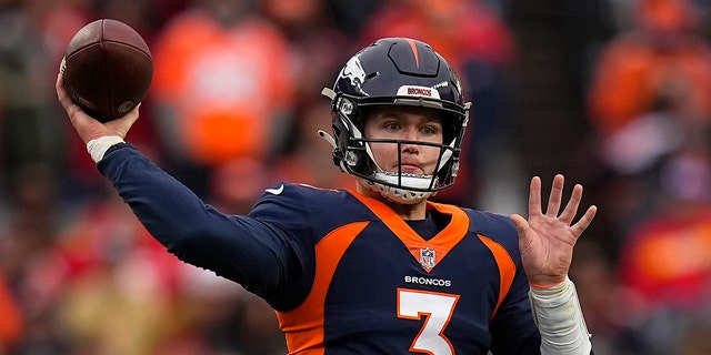 FILE - Denver Broncos quarterback Drew Lock (3) passes against the Kansas City Chiefs during the first half of an NFL football game on January 8, 2022 in Denver. Lock says he's relishing the opportunity to start his career all over again after his swap with the Seattle Seahawks.