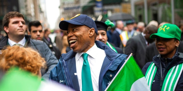 New York Mayor Eric Adams, center smiles as he marches up Fifth Avenue during the St. Patrick's Day Parade, Thursday, March 17, 2022, in New York. 
