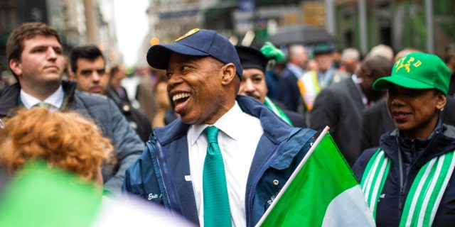 New York Mayor Eric Adams, center smiles as he marches up Fifth Avenue during the St. Patrick's Day Parade, Thursday, March 17, 2022, in New York.