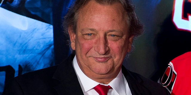 FILE - Ottawa Senators team owner Eugene Melnyk attends an NHL hockey news conference Dec. 4, 2014, in Ottawa. The Senators say Melnyk has died from an illness at age 62. The team announced the news with a statement from his family.