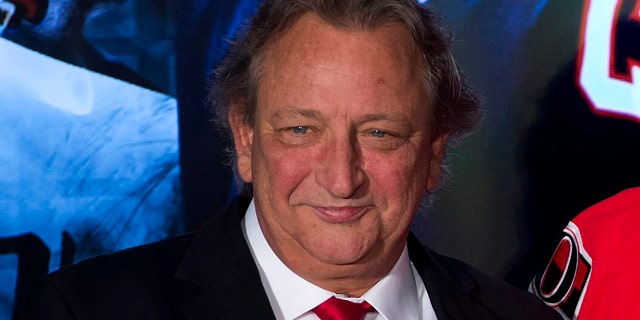 FILE - Ottawa Senators team owner Eugene Melnyk attends an NHL hockey news conference Dec. 4, 2014, in Ottawa. The Senators say Melnyk has died from an illness at age 62. The team announced the news with a statement from his family.