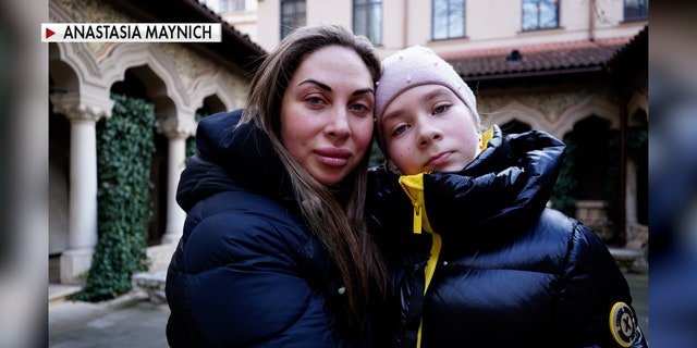 Tetiana and 11-year-old Sofiia are pictured above after crossing into Bucharest. (Anastasia Maynich)