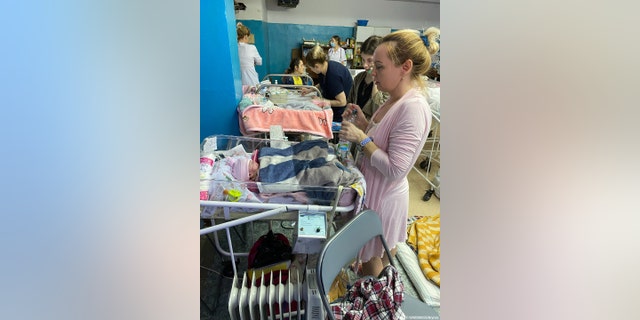 A mother in a makeshift NICU in the Saltivka region of Kharkiv, Ukraine