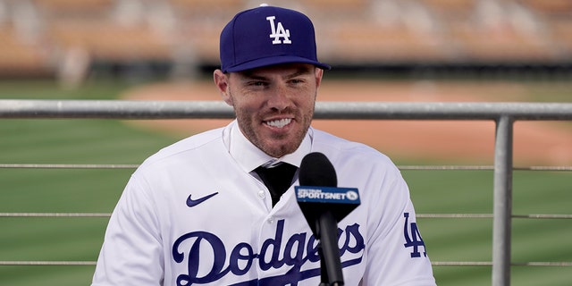 Los Angeles Dodgers' Freddie Freeman speaks during an introductory news conference at spring training baseball, Friday, March 18, 2022, in Glendale, Ariz.