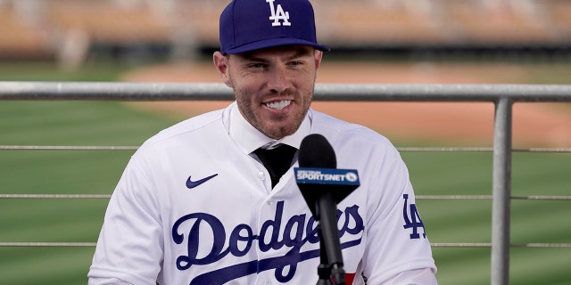 Los Angeles Dodgers' Freddie Freeman speaks during an introductory news conference at spring training baseball, Friday, March 18, 2022, in Glendale, Ariz.