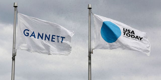 The corporate flags for the Gannett Co and its flagship newspaper, USA Today, fly outside their corporate headquarters. 