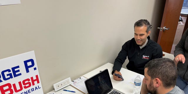 Texas Land Commissioner and GOP attorney general candidate George P. Bush joins volunteers in phone banking on the eve of the Texas primary, on Feb. 28, 2022