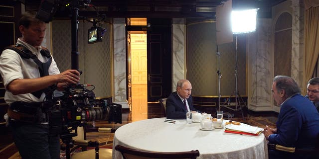In this picture taken June 19, 2019, film director Oliver Stone interviews Putin in Moscow.