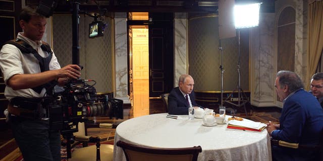 In this picture taken June 19, 2019, film director Oliver Stone interviews Putin in Moscow.