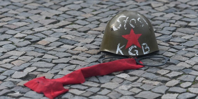 A Russian KGB/Stasi helmet in front of Brandenburg Gate in Berlin, just two days ahead of the 30th anniversary of the fall of the Berlin Wall, Nov. 7, 2019, in Berlin, Germany. 
