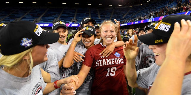 Goalie Katie Meyer of the Stanford Cardinal celebrates with her teammates after defeating the North Carolina Tar Heels during the Division I Women's Soccer Championship at Avaya Stadium on Dec. 8, 2019, in San Jose, California. Stanford defeated North Carolina in a shootout.
