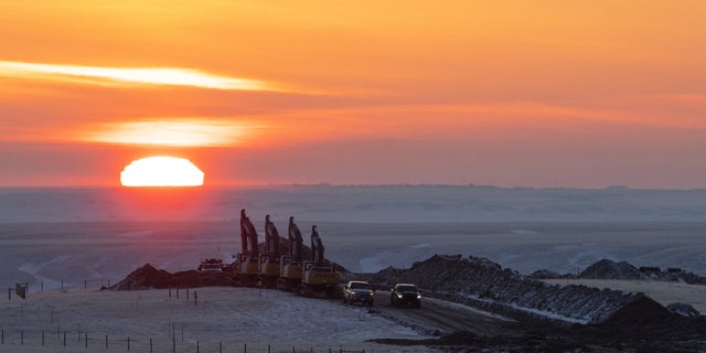 Crews work on a right of way for the Keystone XL pipeline near Oyen, Alberta, Canada, on Wednesday, Jan. 27, 2021. Photographer: Jason Franson/Bloomberg via Getty Images