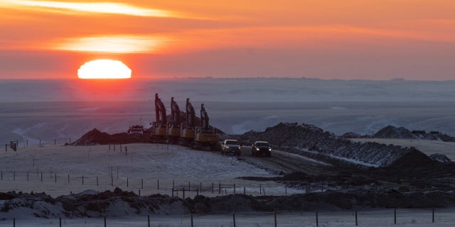 Crews work on a right of way for the Keystone XL pipeline near Oyen, Alberta, Canada, on Wednesday, Jan. 27, 2021.