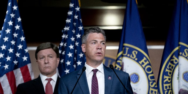 Representative Jim Banks, a Republican from Indiana, right, speaks during a news conference following an all member House briefing on Afghanistan at the U.S. Capitol in Washington, D.C., U.S., on Tuesday, Aug. 24, 2021. Photographer: Stefani Reynolds/Bloomberg