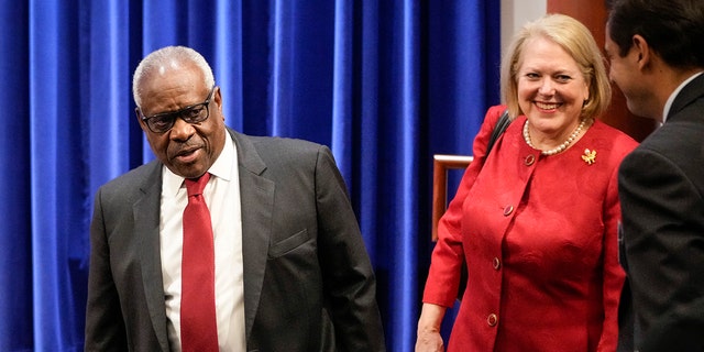 Justice Clarence Thomas and his wife Virginia "Ginni" Thomas arrive at the Heritage Foundation on Oct. 21, 2021 in Washington, D.C.