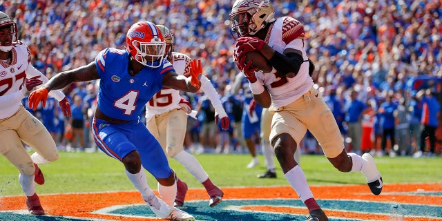 Florida State Seminoles defensive back Jarvis Brownlee Jr. (3) intercepts a pass in the end zone during the game between the Florida State Seminoles and the Florida Gators on November 27, 2021 at Ben Hill Griffin Stadium in Gainesville, Fl.