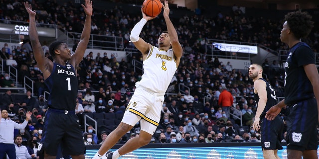 Providence Friars forward Ed Croswell (5) shoots a fall-away shot while defended by Butler Bulldogs guard Bo Hodges (1) during a college basketball game between Butler and Providence on Jan. 23, 2022, at the Dunkin Donuts Center in Providence, Rhode Island.